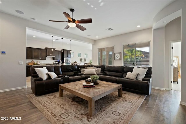 living area featuring visible vents, baseboards, a ceiling fan, recessed lighting, and wood finished floors