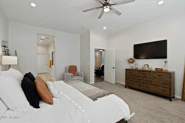 bedroom with recessed lighting, light colored carpet, and baseboards