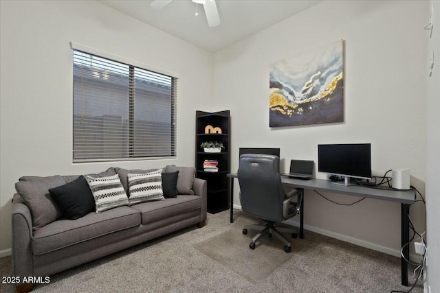 office area with baseboards, a ceiling fan, and carpet floors