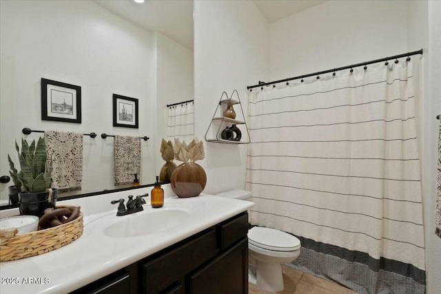 full bath featuring tile patterned floors, toilet, curtained shower, and vanity