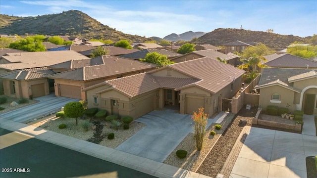 drone / aerial view featuring a mountain view and a residential view