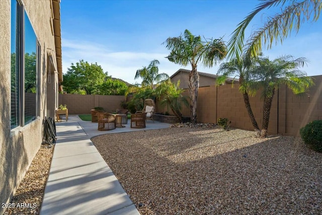 view of yard with a patio and a fenced backyard