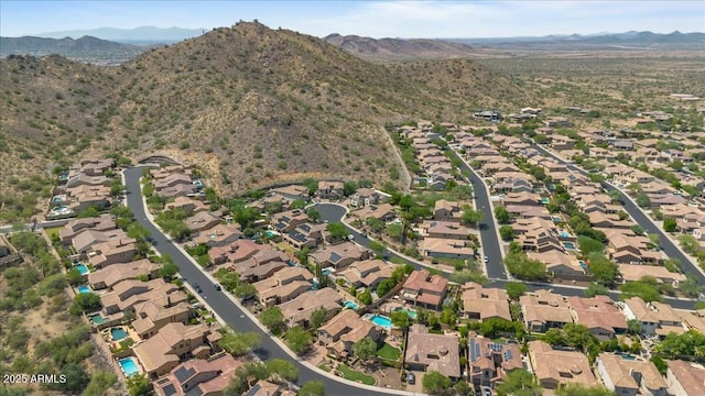 drone / aerial view featuring a residential view and a mountain view