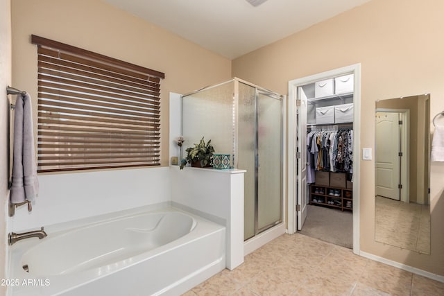 5735 S Cloverdale Ln, Gilbert, AZ 85298 - full bath featuring a garden tub, a stall shower, a spacious closet, and tile patterned floors
