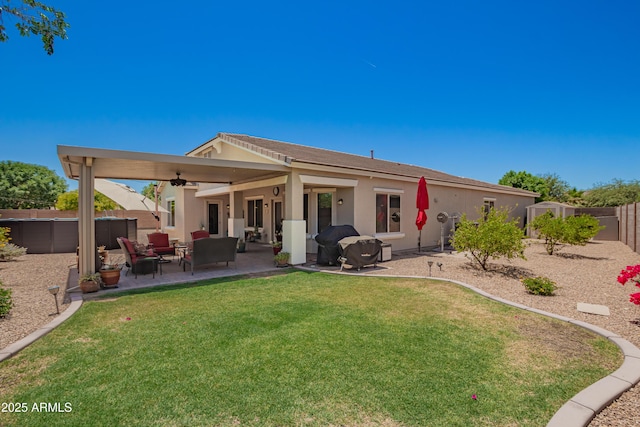 5735 S Cloverdale Ln, Gilbert, AZ 85298 - back of house with a ceiling fan, stucco siding, a fenced backyard, and a patio