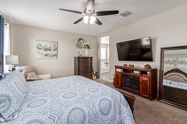 4108 N 304th Ln, Buckeye, AZ 85396 - carpeted bedroom with ensuite bathroom and a ceiling fan