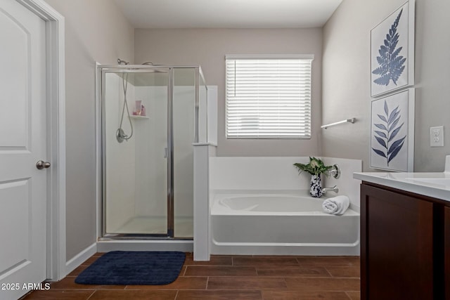 4108 N 304th Ln, Buckeye, AZ 85396 - bathroom featuring a garden tub, a stall shower, vanity, and wood finish floors