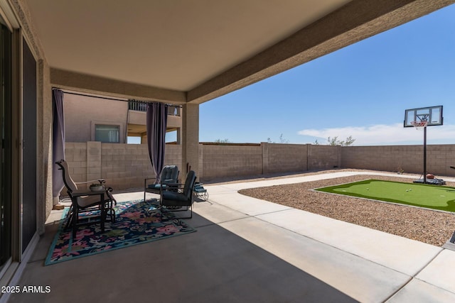 4108 N 304th Ln, Buckeye, AZ 85396 - fenced backyard featuring a putting green and a patio area