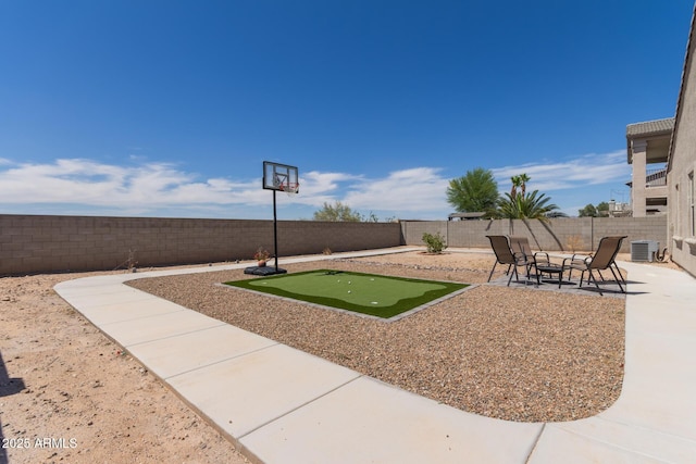 4108 N 304th Ln, Buckeye, AZ 85396 - fenced backyard featuring an area to practice putting and a patio