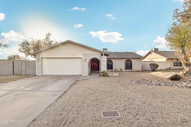 ranch-style home featuring a garage