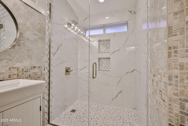 17421 N 14th St, Phoenix, AZ 85022 - bathroom with a marble finish shower, vanity, and tile walls