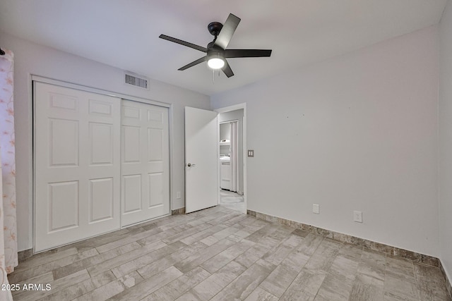 17421 N 14th St, Phoenix, AZ 85022 - unfurnished bedroom with a closet, washer / clothes dryer, a ceiling fan, and baseboards