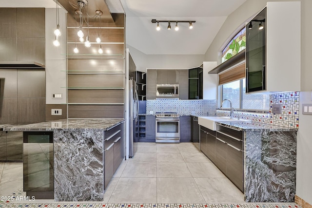 17421 N 14th St, Phoenix, AZ 85022 - kitchen featuring appliances with stainless steel finishes, a sink, tasteful backsplash, modern cabinets, and light stone countertops