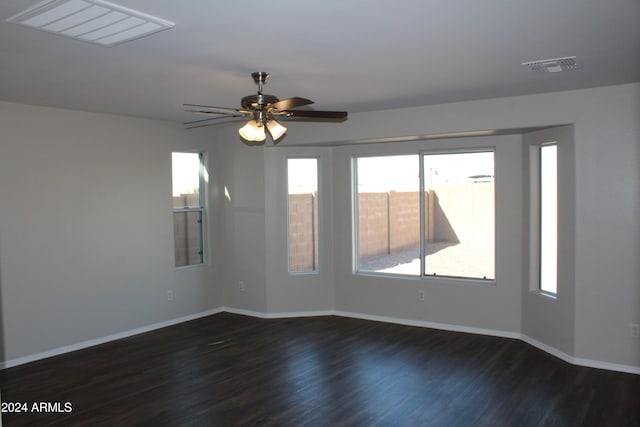 empty room featuring dark hardwood / wood-style floors and ceiling fan