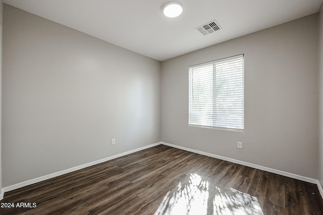41208 W Bravo Dr, Maricopa, AZ 85138 - unfurnished room featuring baseboards and dark wood-style floors