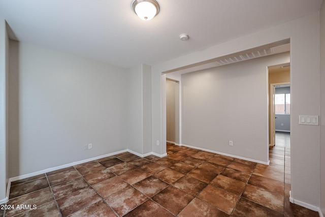 41208 W Bravo Dr, Maricopa, AZ 85138 - empty room featuring a smoke detector and baseboards