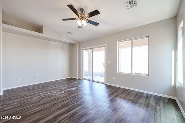 41208 W Bravo Dr, Maricopa, AZ 85138 - empty room with lofted ceiling, dark wood-style flooring, a ceiling fan, and baseboards