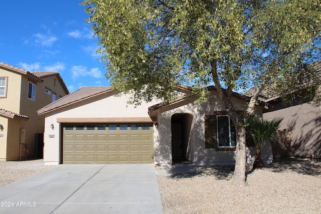 mediterranean / spanish-style home featuring a garage