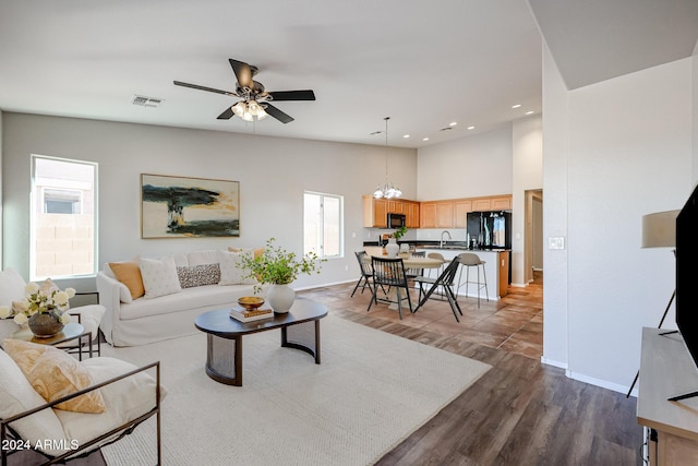 41208 W Bravo Dr, Maricopa, AZ 85138 - living area featuring a towering ceiling, baseboards, a ceiling fan, recessed lighting, and dark wood-style floors