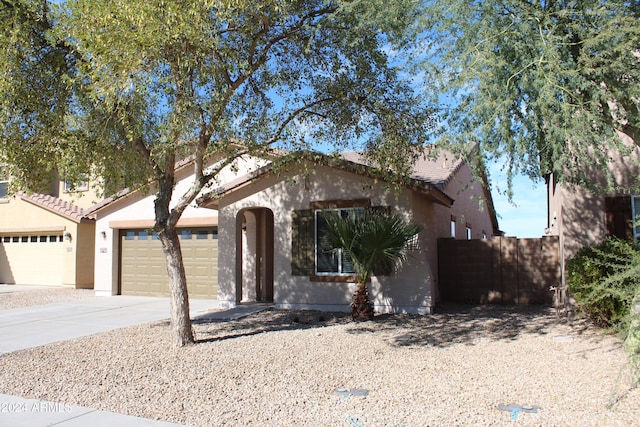 view of front of property with a garage