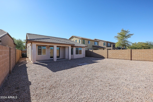 41208 W Bravo Dr, Maricopa, AZ 85138 - back of property with a tile roof, a fenced backyard, and stucco siding