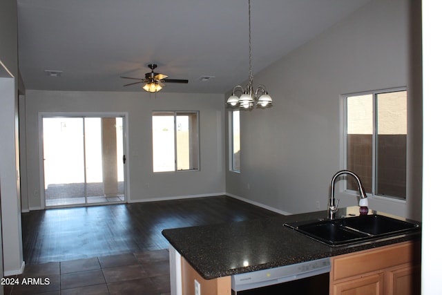 kitchen featuring dishwasher, sink, dark wood-type flooring, decorative light fixtures, and ceiling fan with notable chandelier