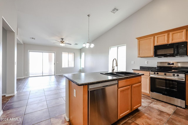 41208 W Bravo Dr, Maricopa, AZ 85138 - kitchen featuring appliances with stainless steel finishes, a sink, dark countertops, lofted ceiling, and a chandelier