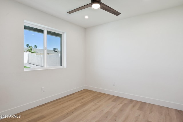 unfurnished room with baseboards, light wood-style floors, a ceiling fan, and recessed lighting