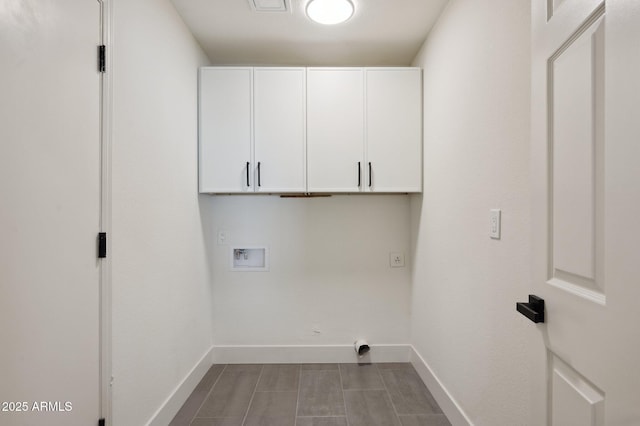 laundry area featuring cabinet space, hookup for a washing machine, and baseboards