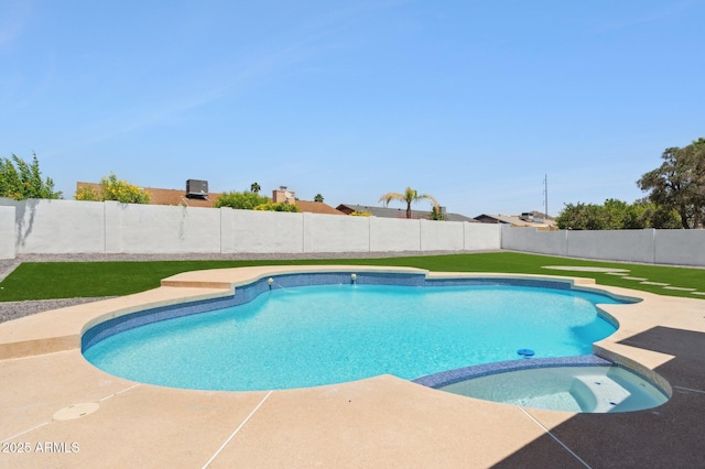 view of swimming pool featuring a fenced backyard and a pool with connected hot tub