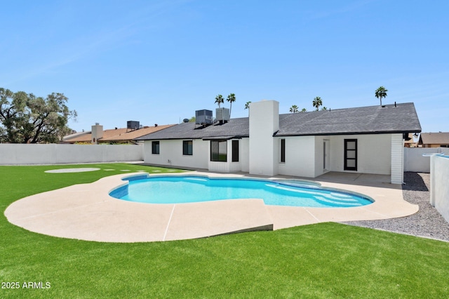 view of pool with a patio, cooling unit, and a pool with connected hot tub