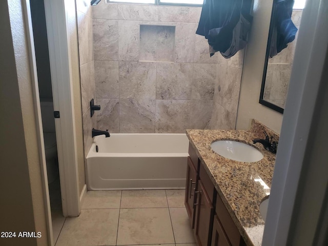 bathroom featuring a bathtub, vanity, and tile patterned floors