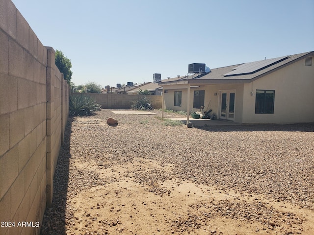 view of yard featuring a patio and central AC unit