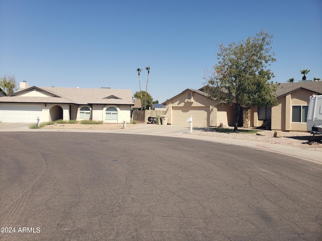 ranch-style house featuring a garage