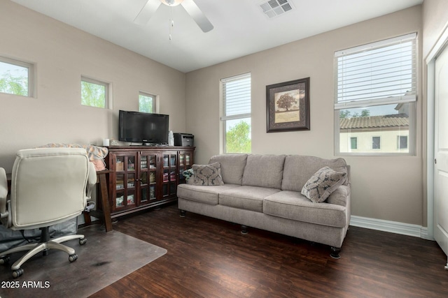 office with a ceiling fan, baseboards, visible vents, and wood finished floors