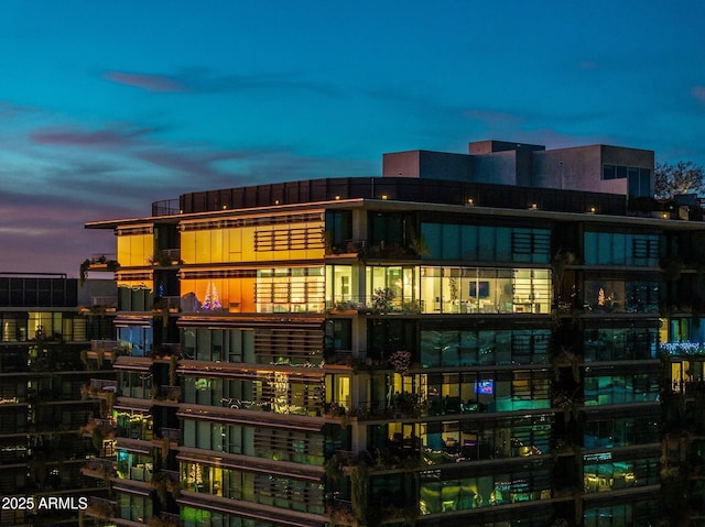 view of outdoor building at dusk