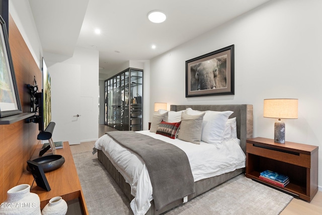 bedroom with light hardwood / wood-style flooring