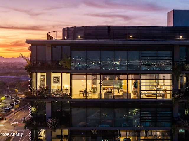 view of outdoor building at dusk