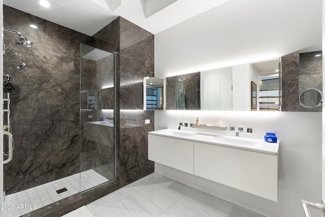 bathroom featuring vanity and an enclosed shower