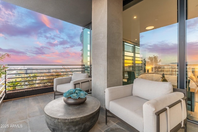 view of balcony at dusk