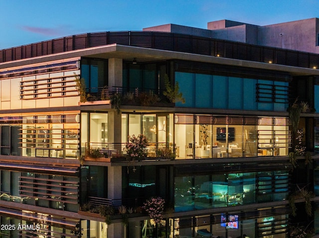 view of outdoor building at dusk