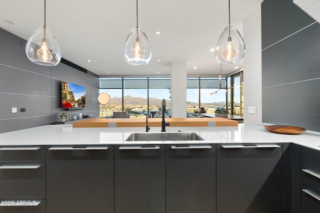 kitchen featuring pendant lighting and sink