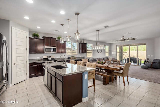 10454 W Maya Way, Peoria, AZ 85383 - kitchen featuring open floor plan, visible vents, a sink, and stainless steel appliances