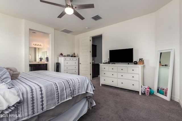 10454 W Maya Way, Peoria, AZ 85383 - bedroom with a ceiling fan, ensuite bath, dark colored carpet, and visible vents