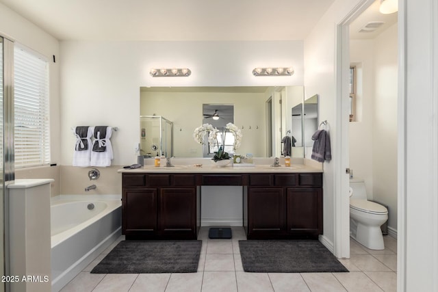 10454 W Maya Way, Peoria, AZ 85383 - full bathroom featuring a stall shower, toilet, a bath, ceiling fan, and double vanity