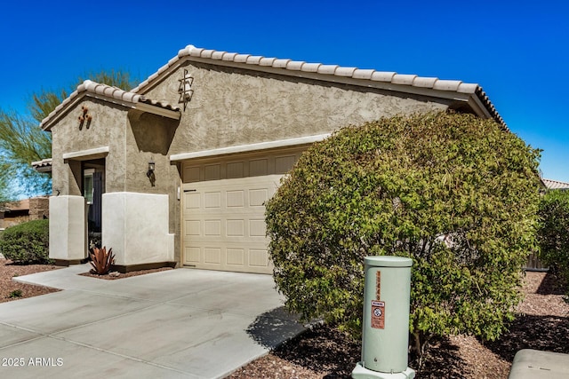 10454 W Maya Way, Peoria, AZ 85383 - view of front of home with a tiled roof, stucco siding, concrete driveway, and a garage