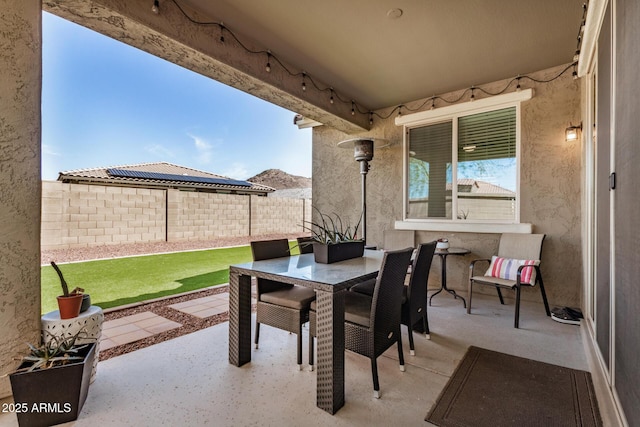 10454 W Maya Way, Peoria, AZ 85383 - view of patio / terrace with outdoor dining area and fence