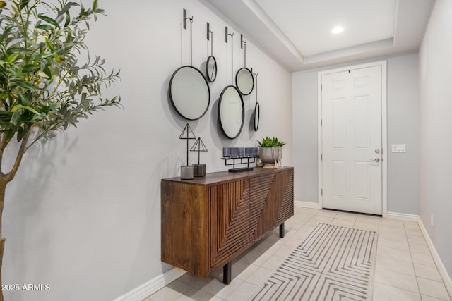 10454 W Maya Way, Peoria, AZ 85383 - entryway featuring a raised ceiling, light tile patterned flooring, and baseboards