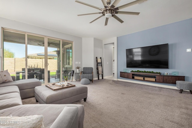 10454 W Maya Way, Peoria, AZ 85383 - living room with carpet flooring, a ceiling fan, and baseboards
