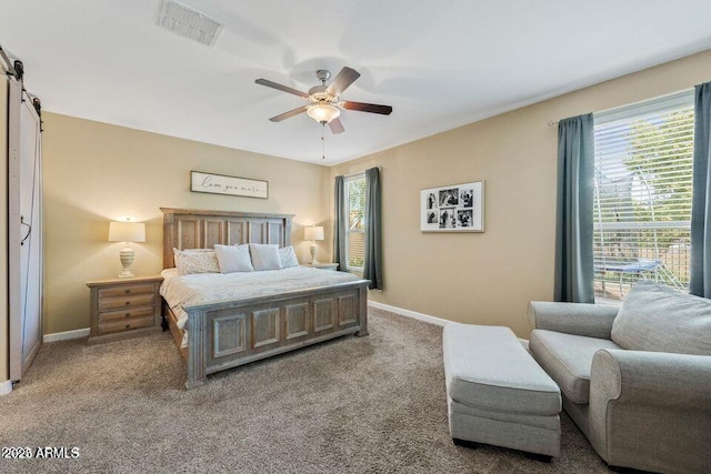 18309 N Crestview Ln, Maricopa, AZ 85138 - carpeted bedroom featuring baseboards, a barn door, and ceiling fan